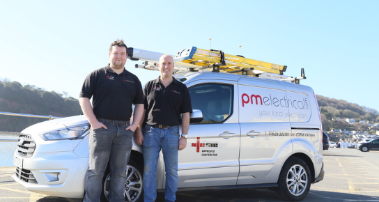 PM Electrical Team In Front Of Company Van