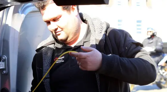 Electrician handling an electrical wire