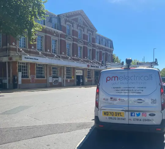 PM Electrical van on a Newton Aboot street