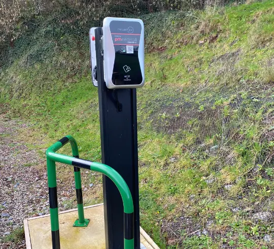 Two EV chargers mounted to a pole Two EV chargers mounted to a pole